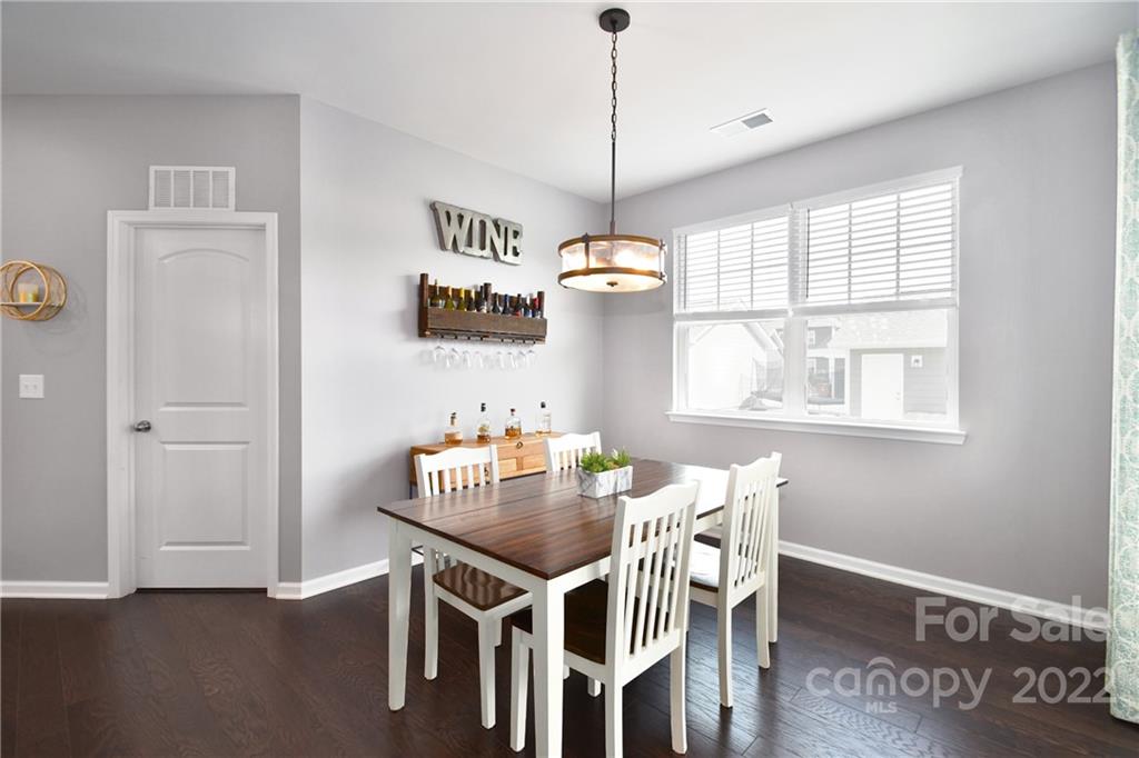 17239 Shearer Road Davidson, NC 28036 - Photo 11 of 32 a view of a dining room with furniture window and wooden floor