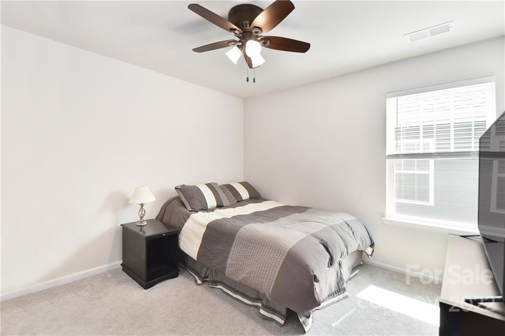17239 Shearer Road Davidson, NC 28036 - Photo 21 of 32 a bedroom with a bed and a large window