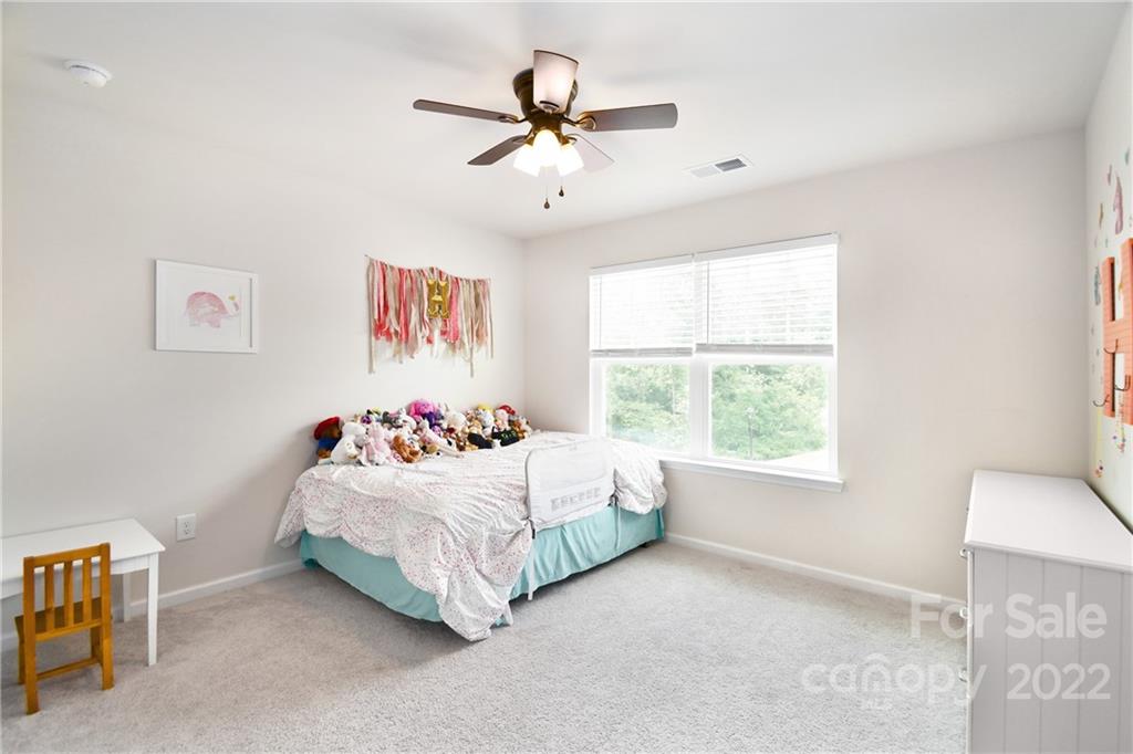 17239 Shearer Road Davidson, NC 28036 - Photo 23 of 32 a bedroom with a bed and window
