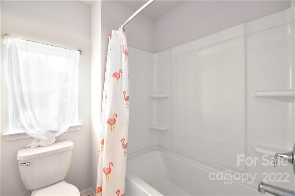 17239 Shearer Road Davidson, NC 28036 - Photo 25 of 32 a bathroom with a toilet sink and shower