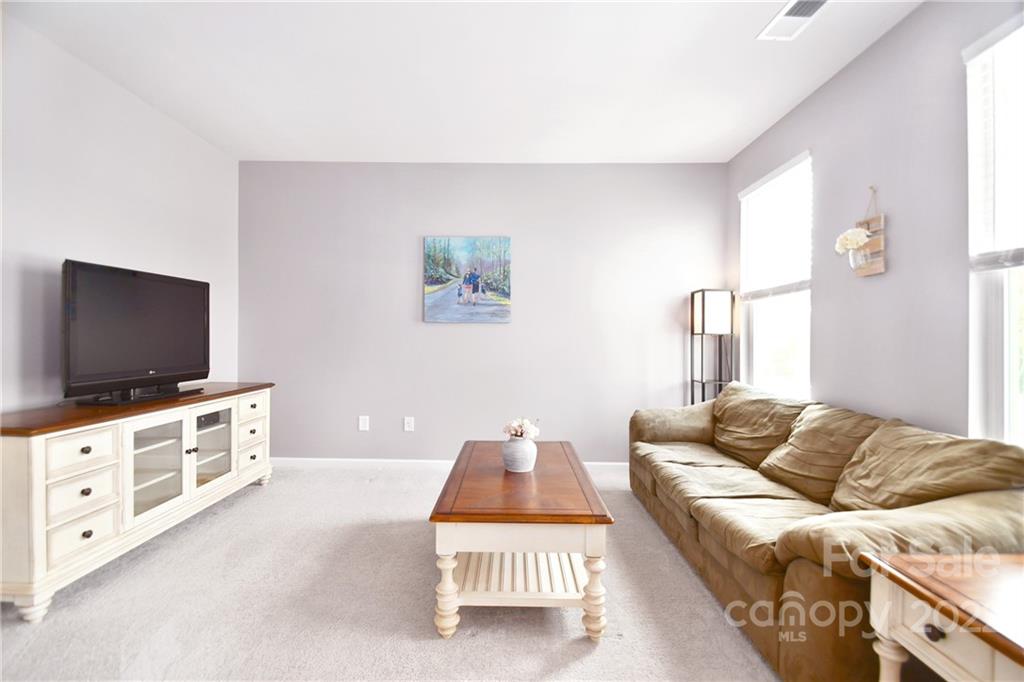 17239 Shearer Road Davidson, NC 28036 - Photo 5 of 32 a living room with furniture and a flat screen tv