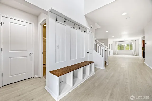 a view of an entryway with wooden floor