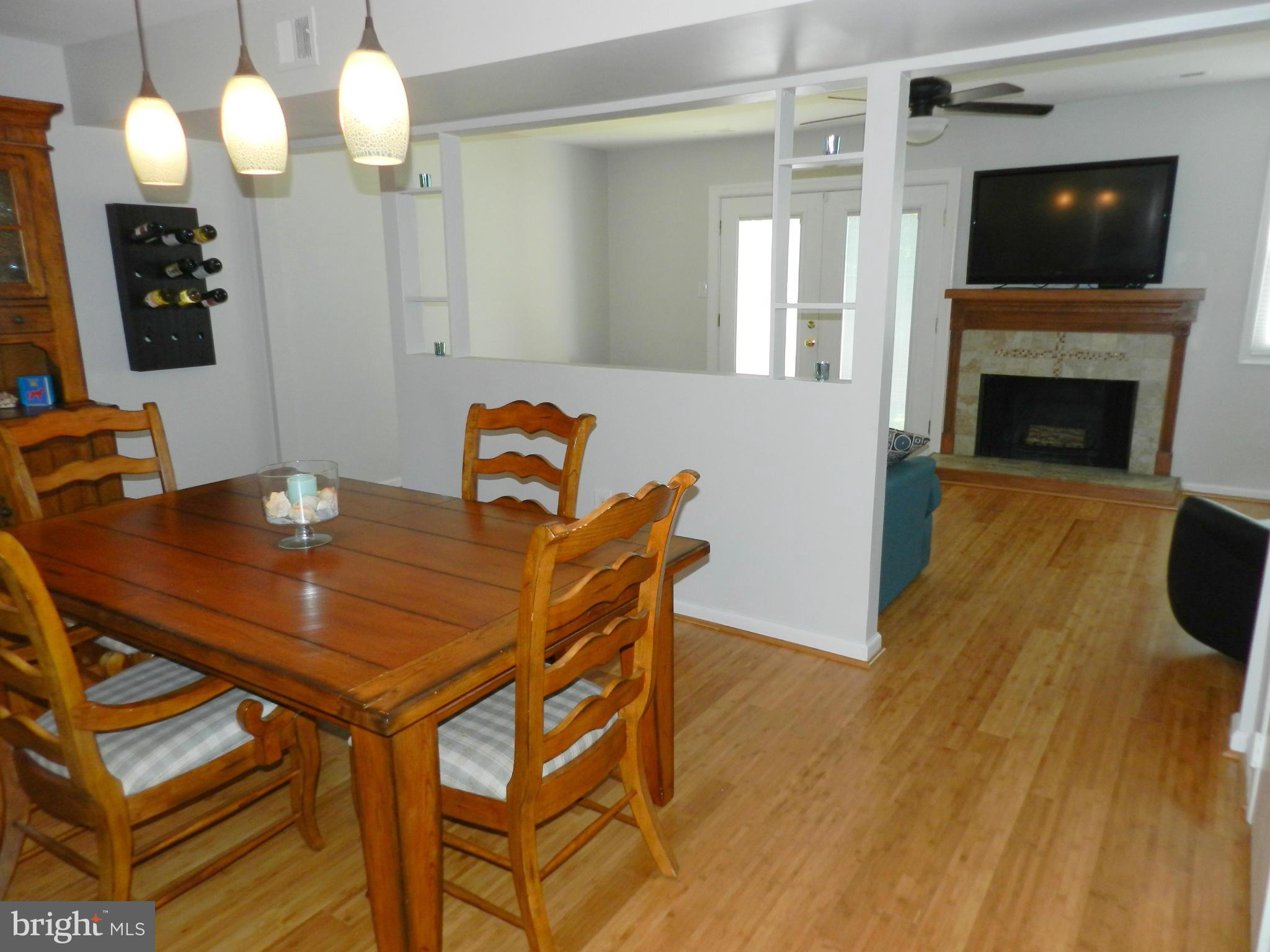 17430 Hughes Road Poolesville, MD 20837 - Photo 14 of 30 a view of a dining room with furniture and wooden floor