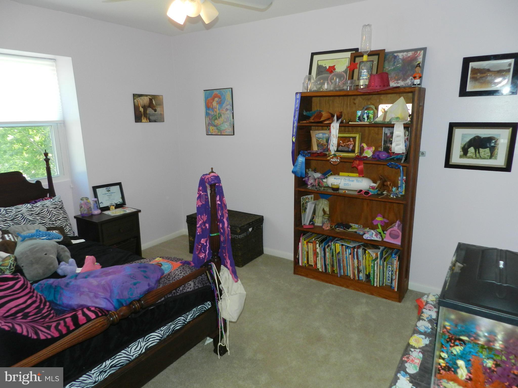 17430 Hughes Road Poolesville, MD 20837 - Photo 22 of 30 a bedroom with bed and a window