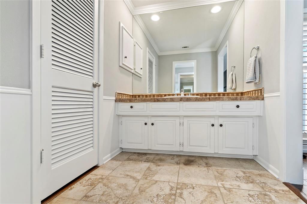 7116 Hunters Ridge Drive Dallas, TX 75248 - Photo 15 of 33 a view of a kitchen with white cabinets