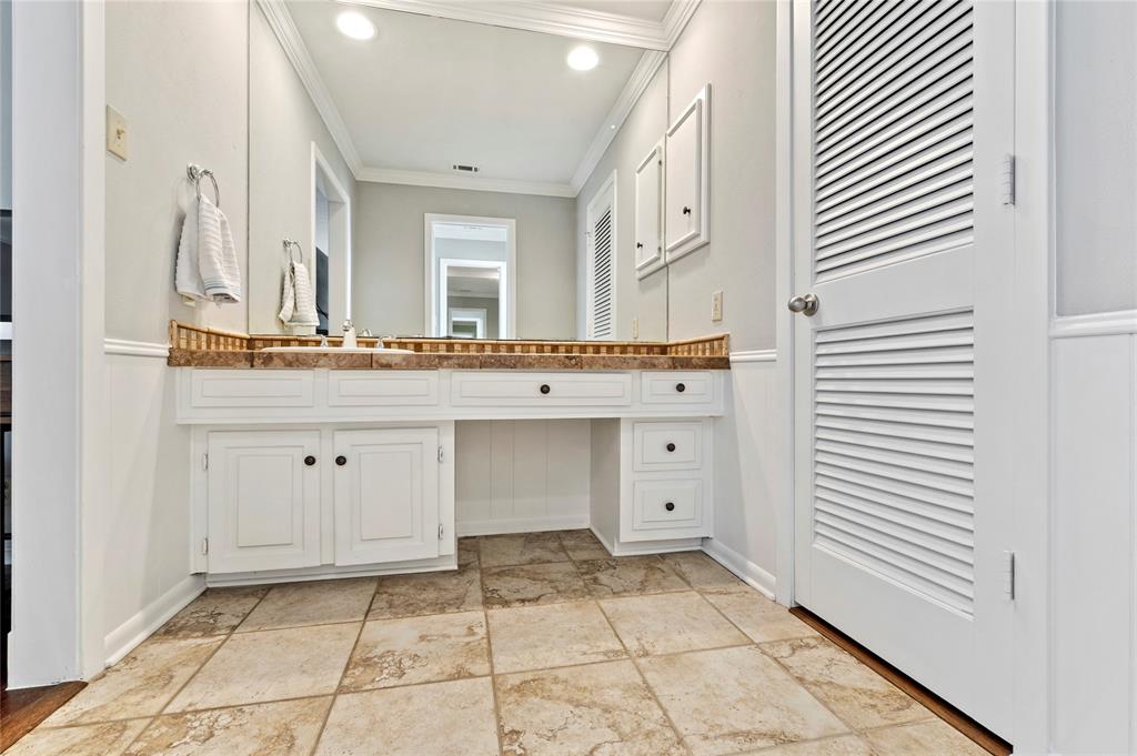 7116 Hunters Ridge Drive Dallas, TX 75248 - Photo 17 of 33 a view of a kitchen with white cabinets