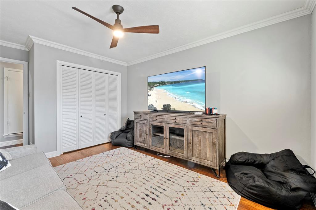 7116 Hunters Ridge Drive Dallas, TX 75248 - Photo 23 of 33 a living room with stainless steel appliances kitchen island granite countertop furniture and a fireplace