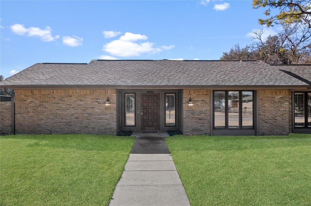 7116 Hunters Ridge Drive Dallas, TX 75248 - Photo 28 of 33 a view of a porch with a yard