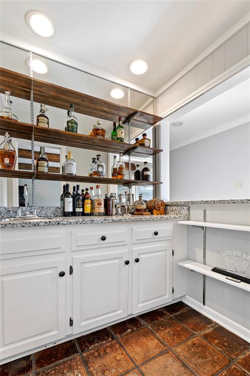 7116 Hunters Ridge Drive Dallas, TX 75248 - Photo 5 of 33 a kitchen with white cabinets and window