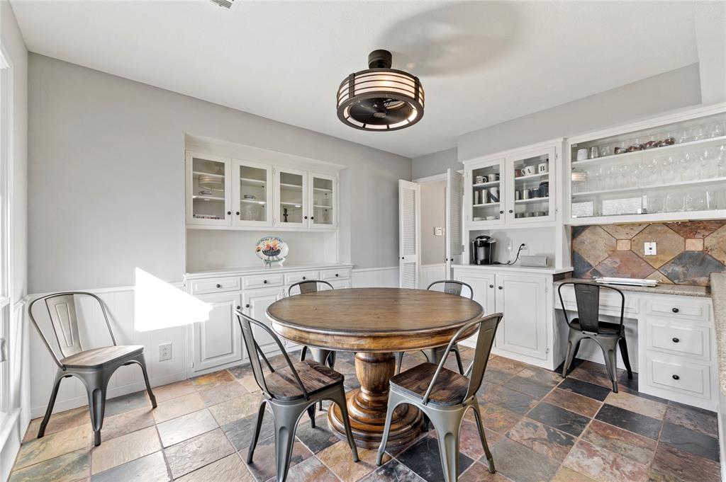 7116 Hunters Ridge Drive Dallas, TX 75248 - Photo 9 of 33 a dining room with furniture and window