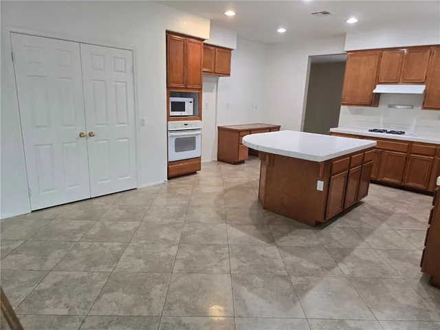 a view of staircase with wooden floor and railing