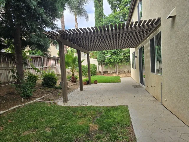 a view of a chair and table in the yard