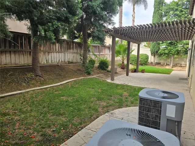 a view of a street with a cars parked in front of it