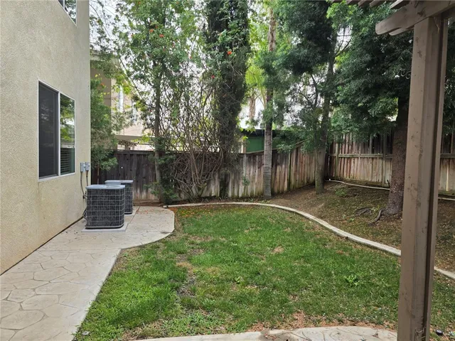 a view of a street with a building in the background