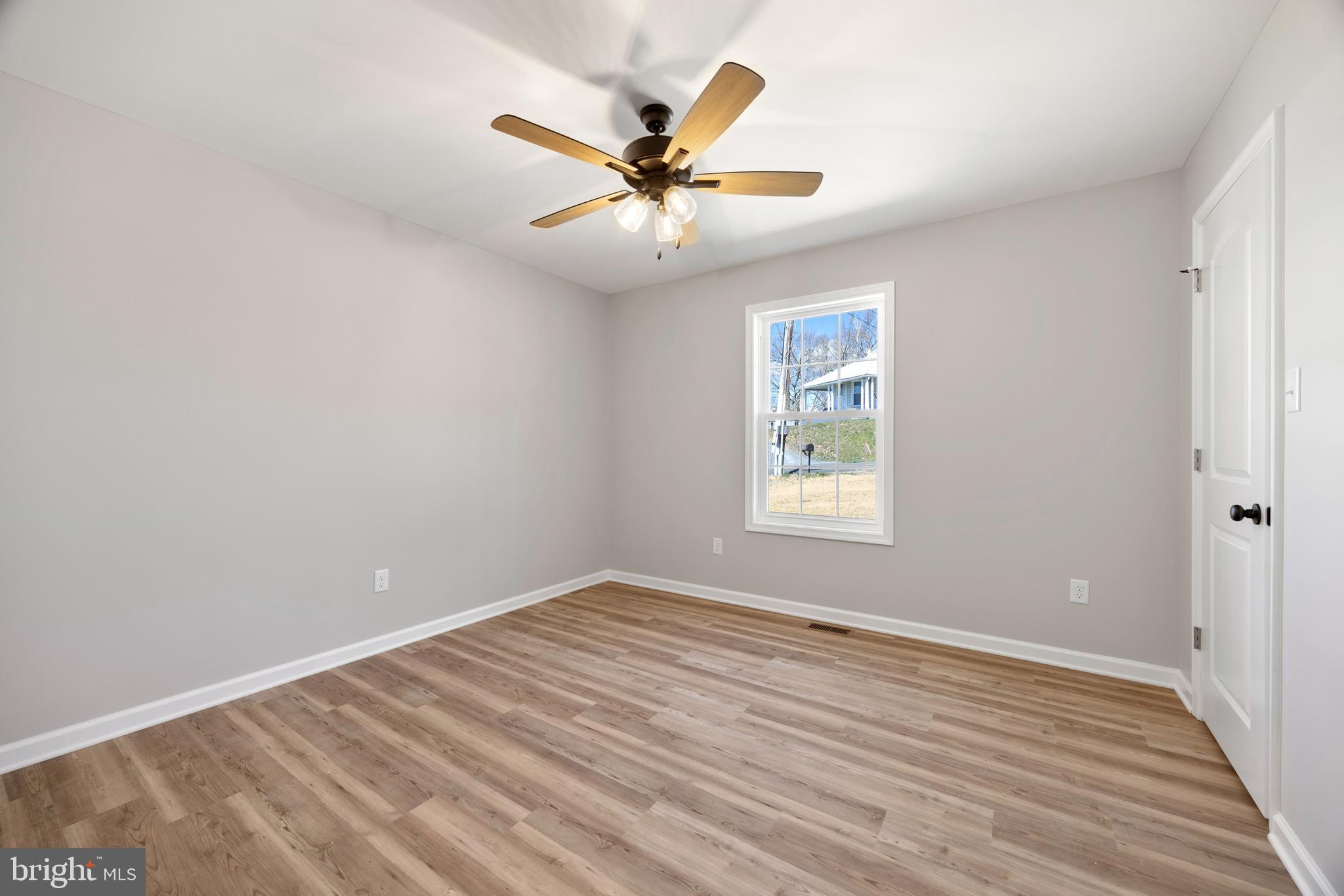 13518 Senedo Road Mount Jackson, VA 22842 - Photo 13 of 22 wooden floor in an empty room with a window