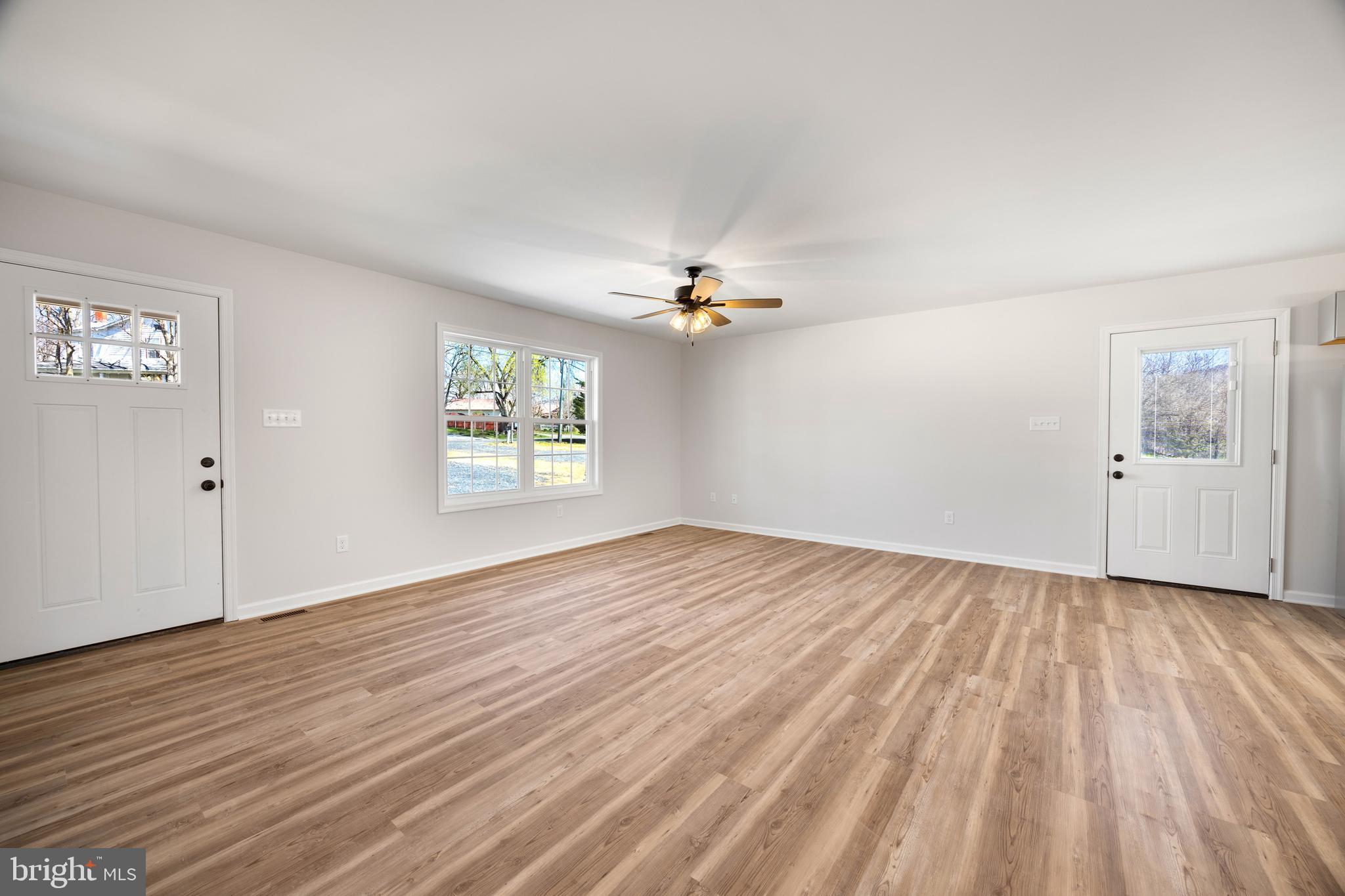 13518 Senedo Road Mount Jackson, VA 22842 - Photo 5 of 22 wooden floor in an empty room with a window