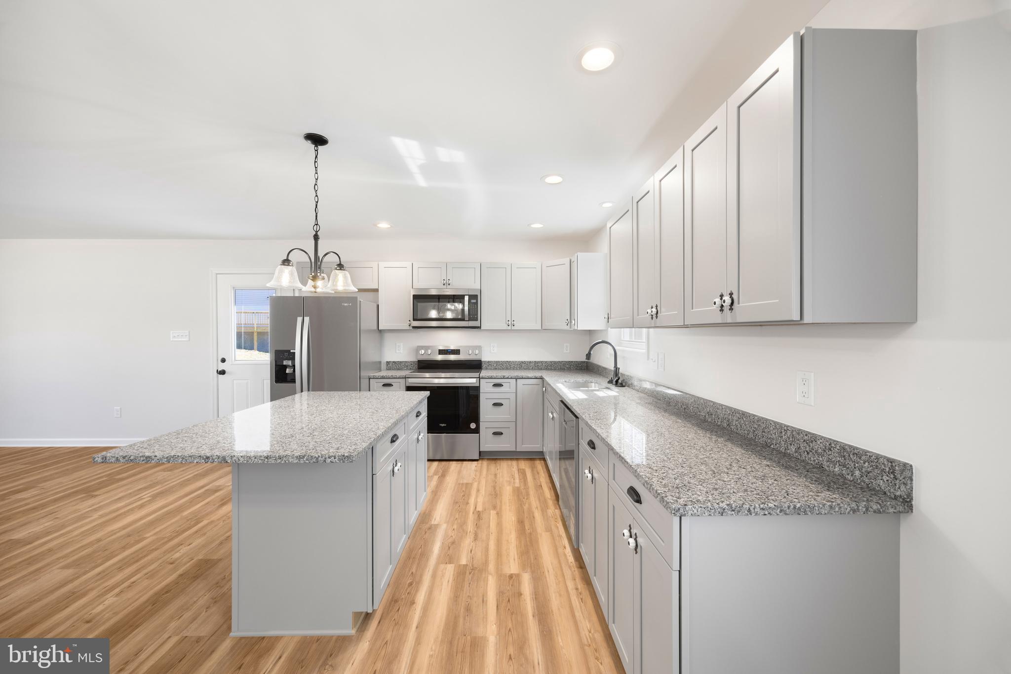 13518 Senedo Road Mount Jackson, VA 22842 - Photo 10 of 22 a kitchen with stainless steel appliances granite countertop a sink a stove and a wooden floors