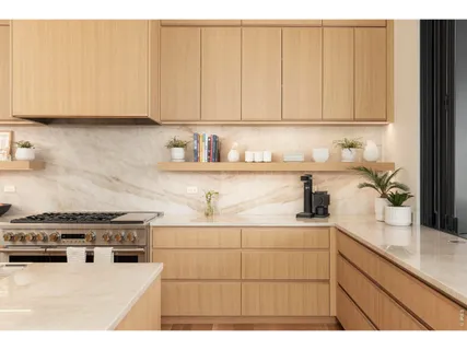 a kitchen with stainless steel appliances granite countertop white cabinets stove and sink