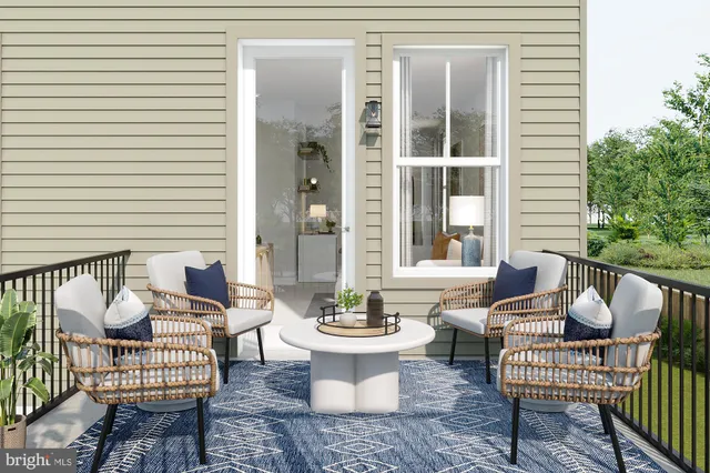 a view of a patio with table and chairs