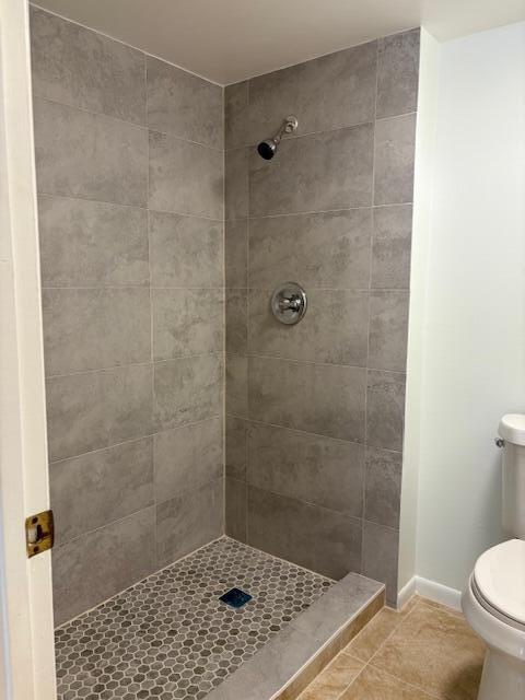 21938 Remsen Terrace, Unit 209 Boca Raton, FL 33433 - Photo 12 of 22 a bathroom with a shower and a toilet