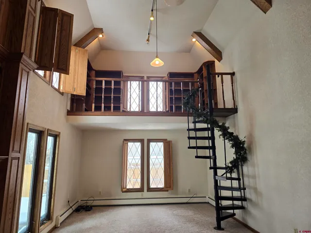 a view of storage and utility room with wooden floor
