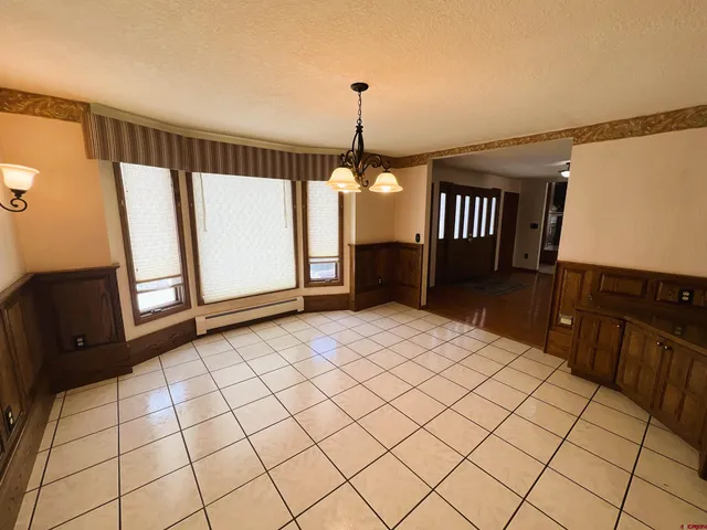 a kitchen with a sink a stove top oven a counter space and cabinets