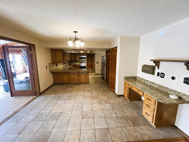 a view of a livingroom with wooden floor and a window