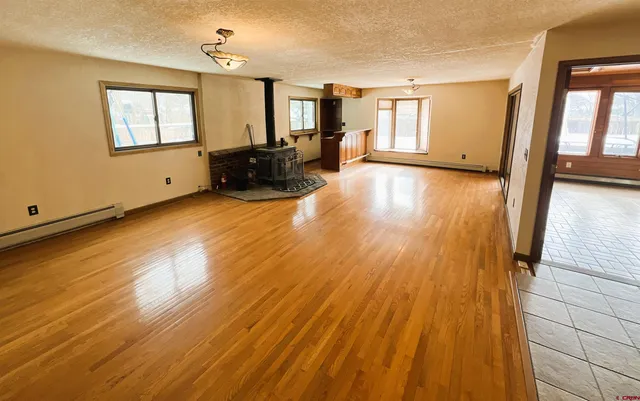 a view of an entryway with wooden floor