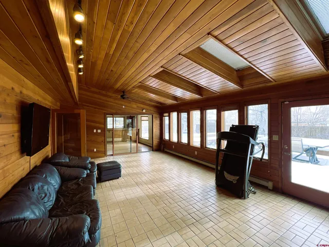 a spacious bedroom with a bed and a fireplace