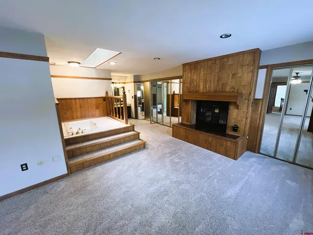 a view of a hallway with kitchen