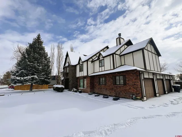 an aerial view of a house with a swimming pool