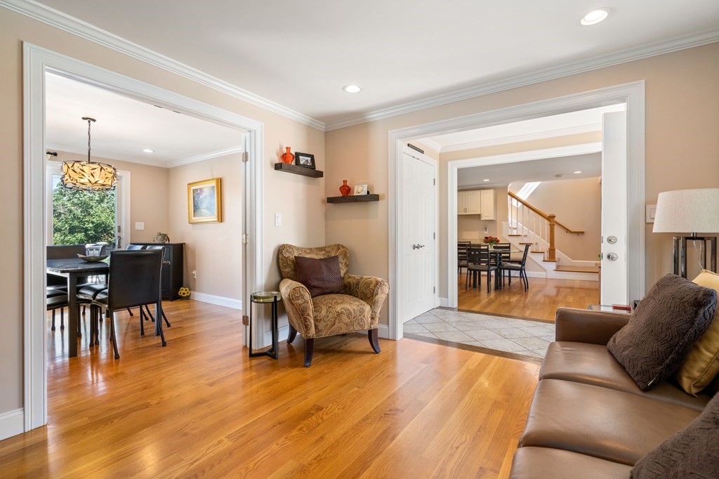 105 Brewster Road Waltham, MA 02451 - Photo 11 of 32 a living room with furniture and a wooden floor