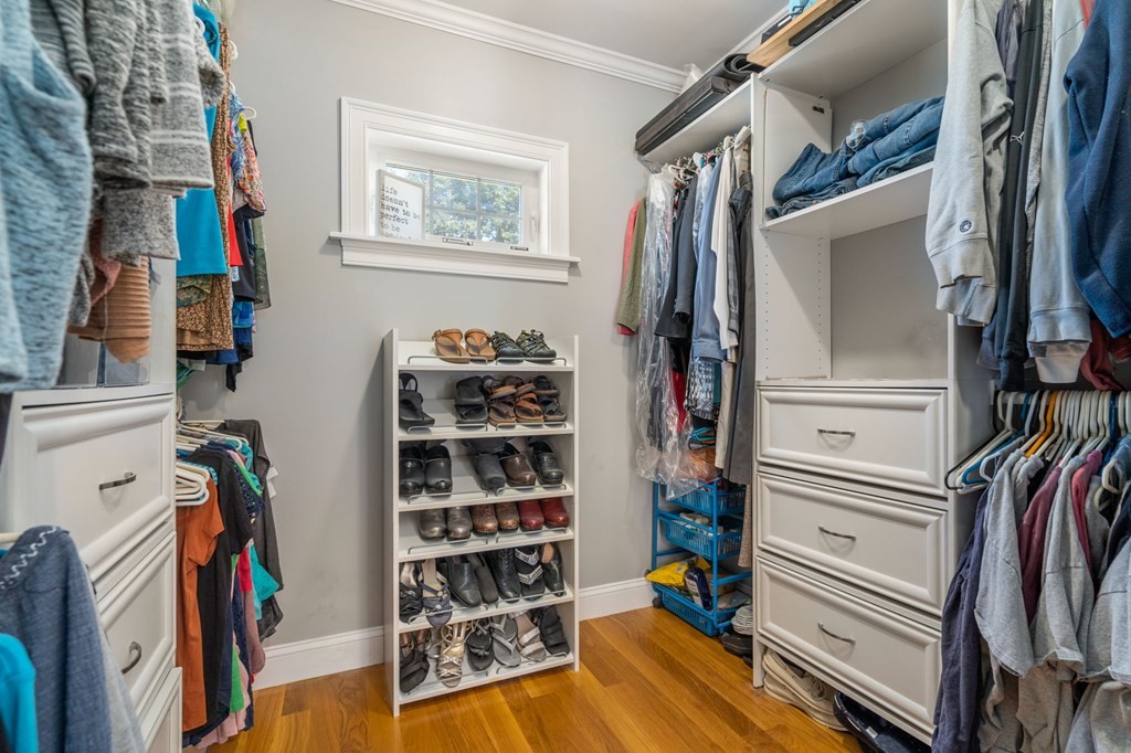 105 Brewster Road Waltham, MA 02451 - Photo 14 of 32 a view of walk in closet with clothes and shoes