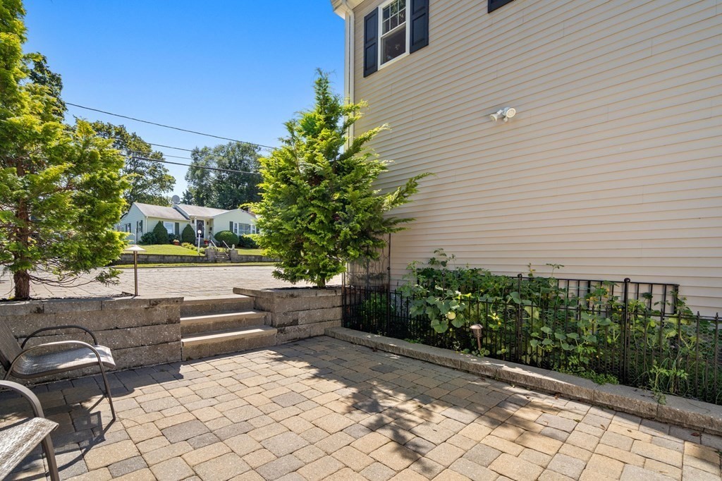105 Brewster Road Waltham, MA 02451 - Photo 22 of 32 a view of a patio with couches and potted plants