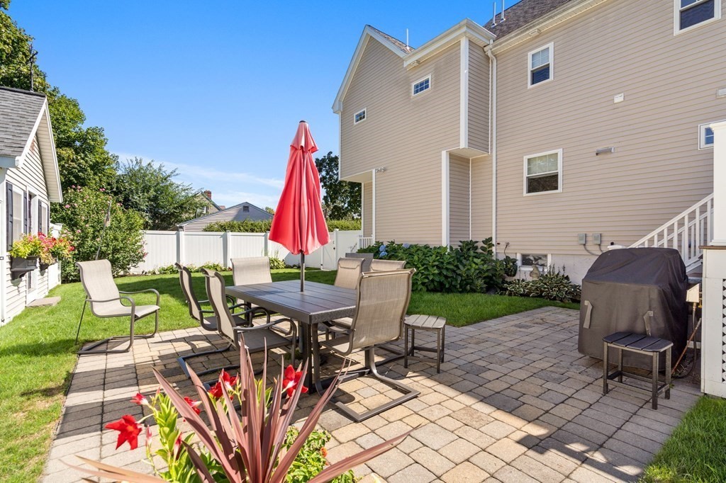 105 Brewster Road Waltham, MA 02451 - Photo 23 of 32 a view of a chairs and table in patio