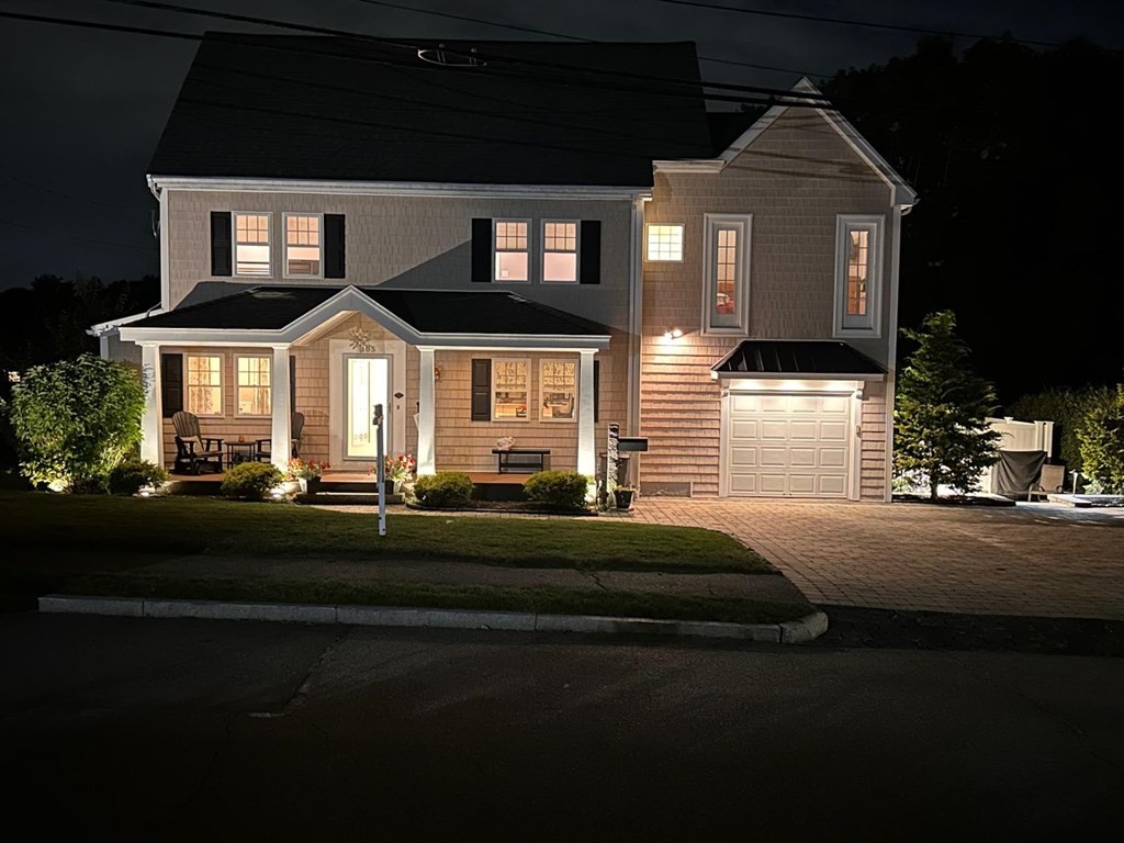 105 Brewster Road Waltham, MA 02451 - Photo 27 of 32 a front view of a house with a garden