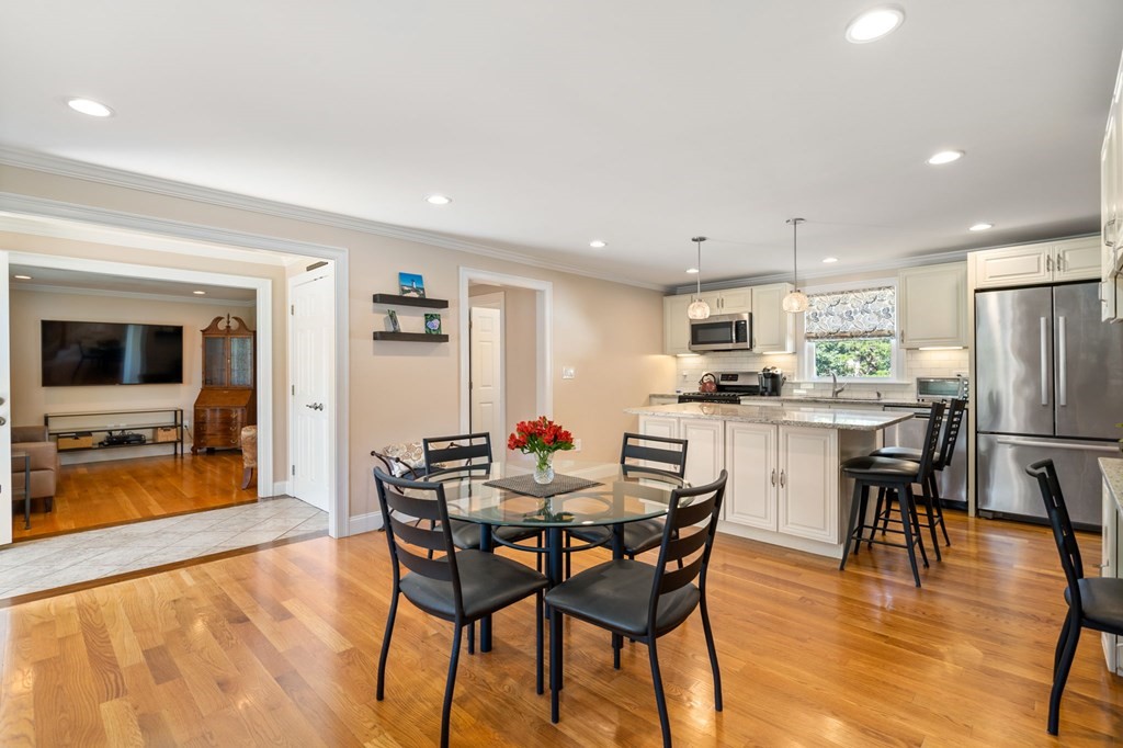 105 Brewster Road Waltham, MA 02451 - Photo 6 of 32 a view of a dining room with furniture and wooden floor