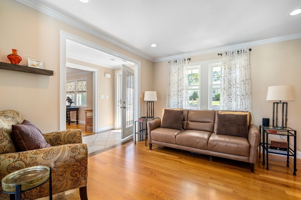 105 Brewster Road Waltham, MA 02451 - Photo 10 of 32 a living room with furniture and a large window