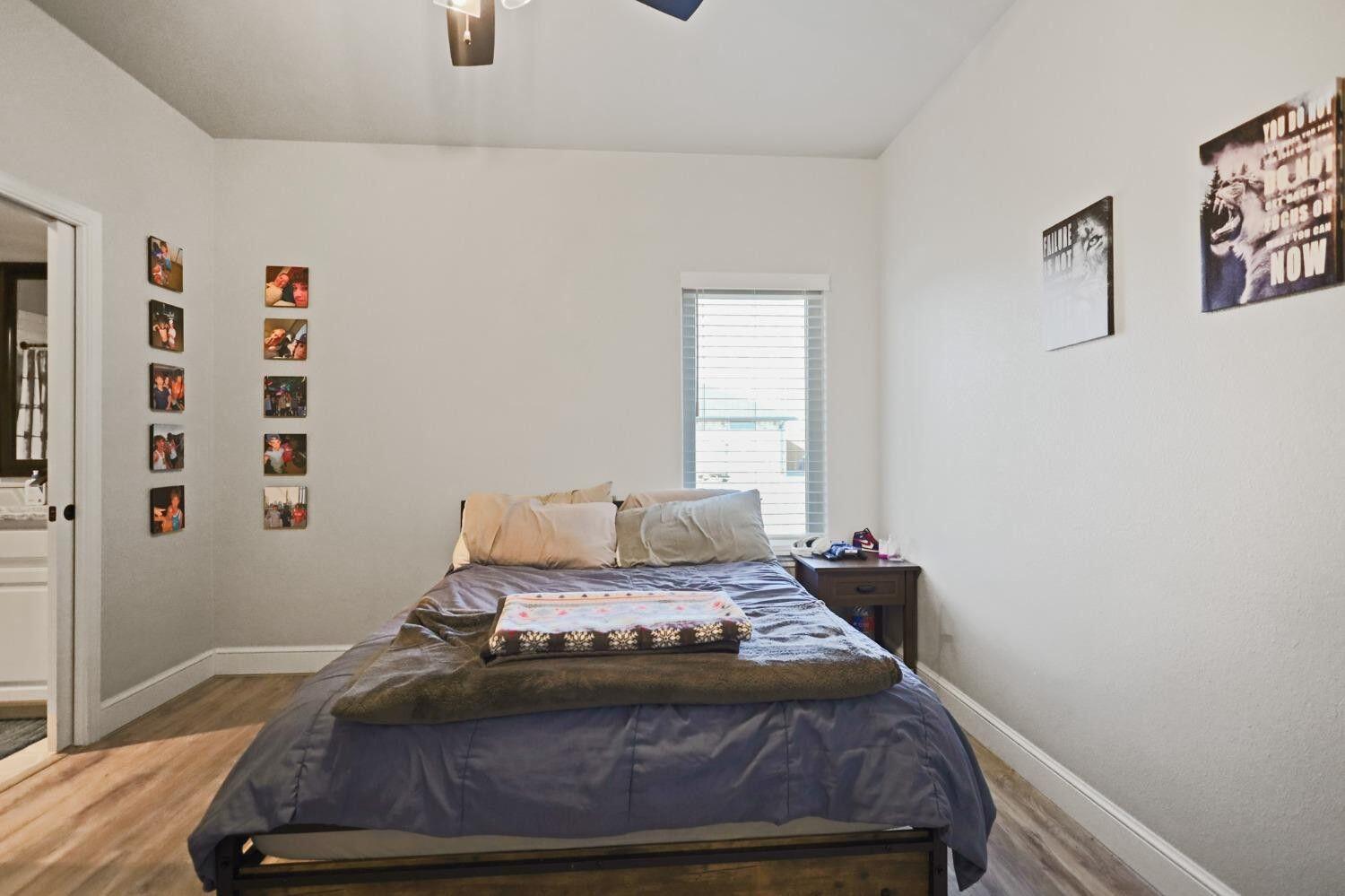 3416 141st Street Lubbock, TX 79423 - Photo 21 of 32 a room with a bed and a window