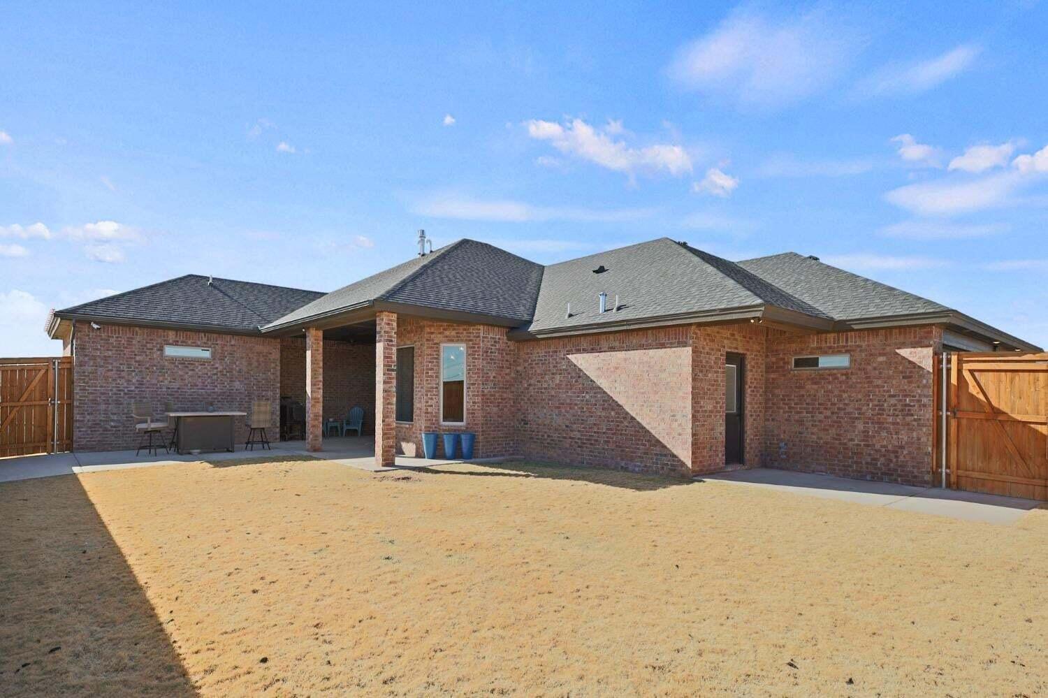 3416 141st Street Lubbock, TX 79423 - Photo 28 of 32 a front view of a house with a yard