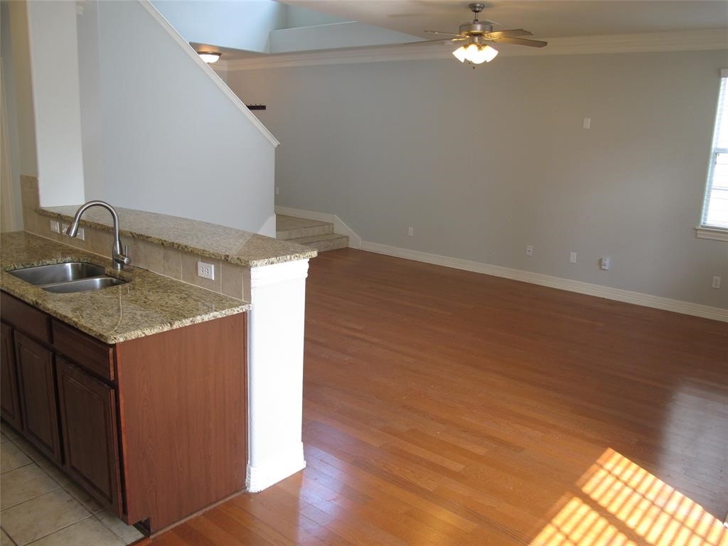 6715 Windrift Way, Unit 15 Austin, TX 78745 - Photo 17 of 37 a room with a sink cabinetry and a chandelier