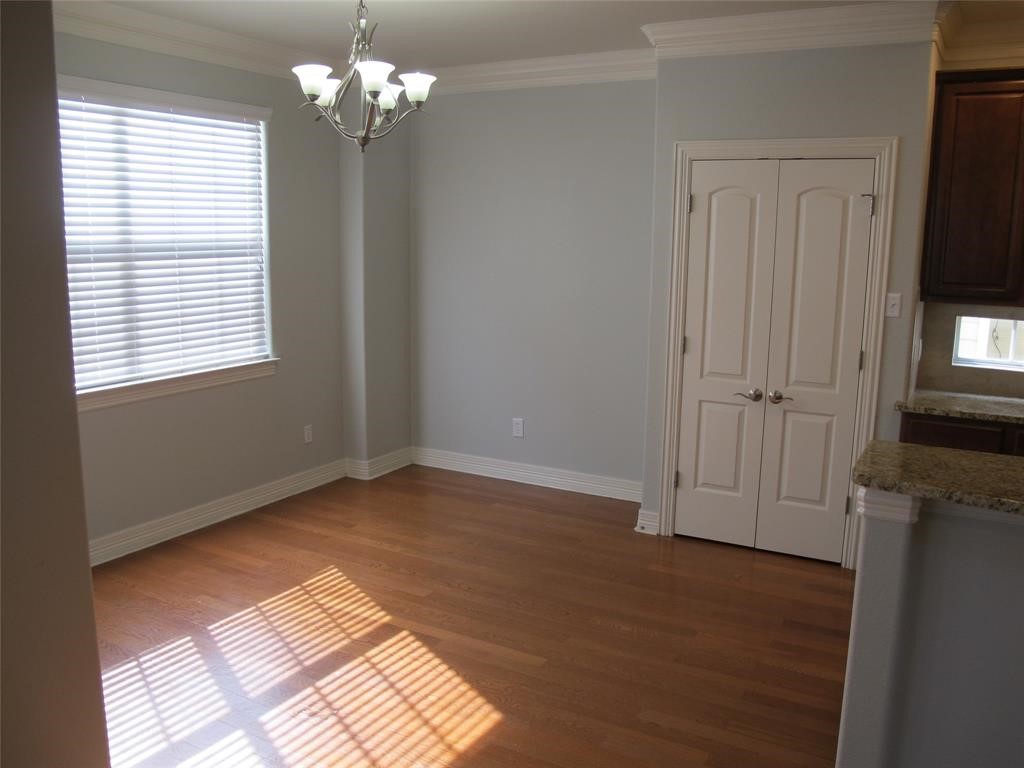 6715 Windrift Way, Unit 15 Austin, TX 78745 - Photo 18 of 37 a view of empty room with wooden floor and fan