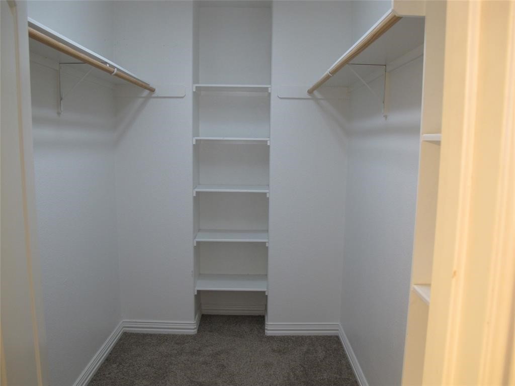 6715 Windrift Way, Unit 15 Austin, TX 78745 - Photo 28 of 37 a view of an empty walk in closet