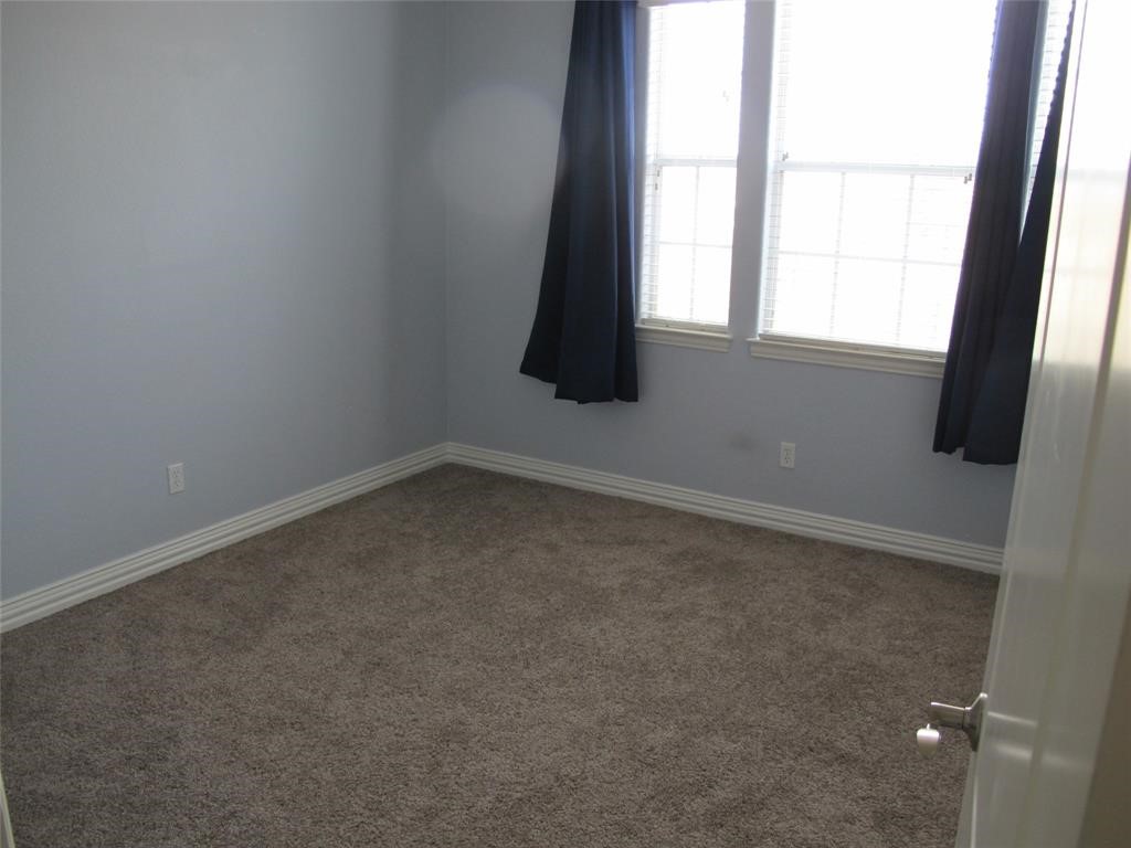 6715 Windrift Way, Unit 15 Austin, TX 78745 - Photo 30 of 37 an empty room with a window