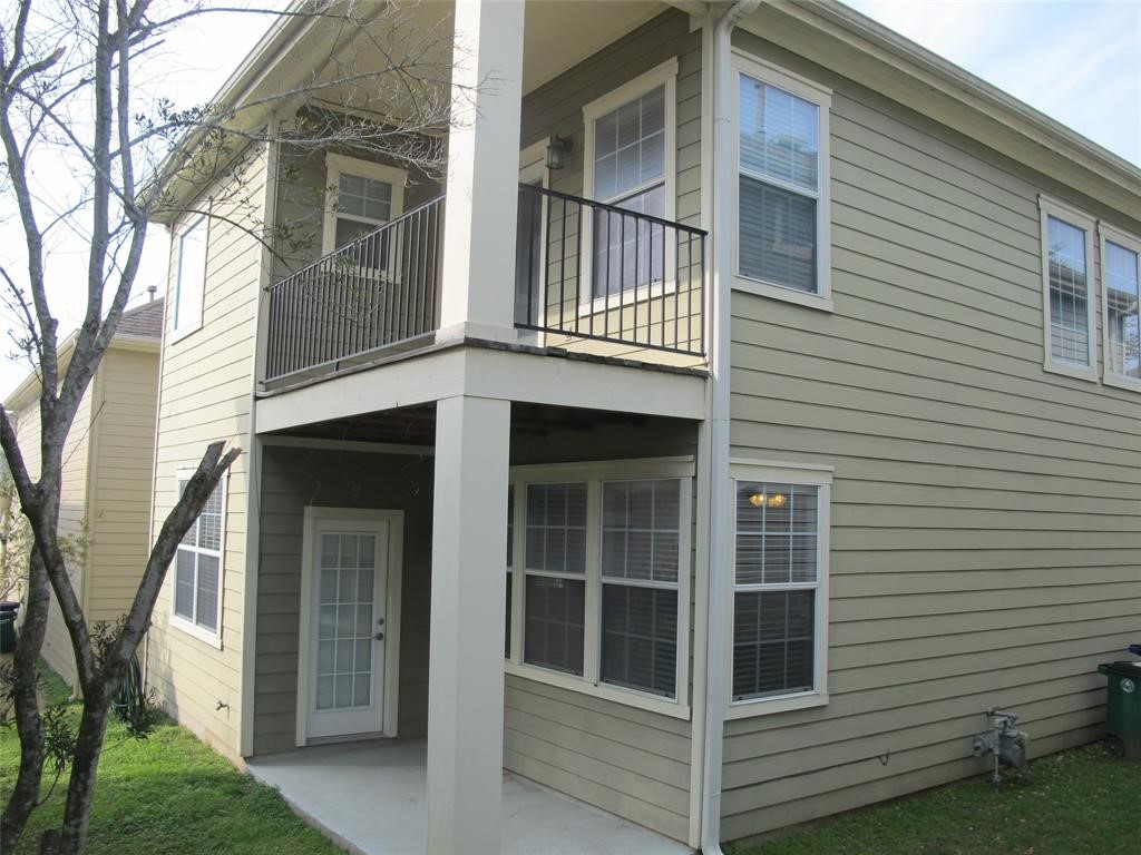 6715 Windrift Way, Unit 15 Austin, TX 78745 - Photo 34 of 37 a view of white house with a large window