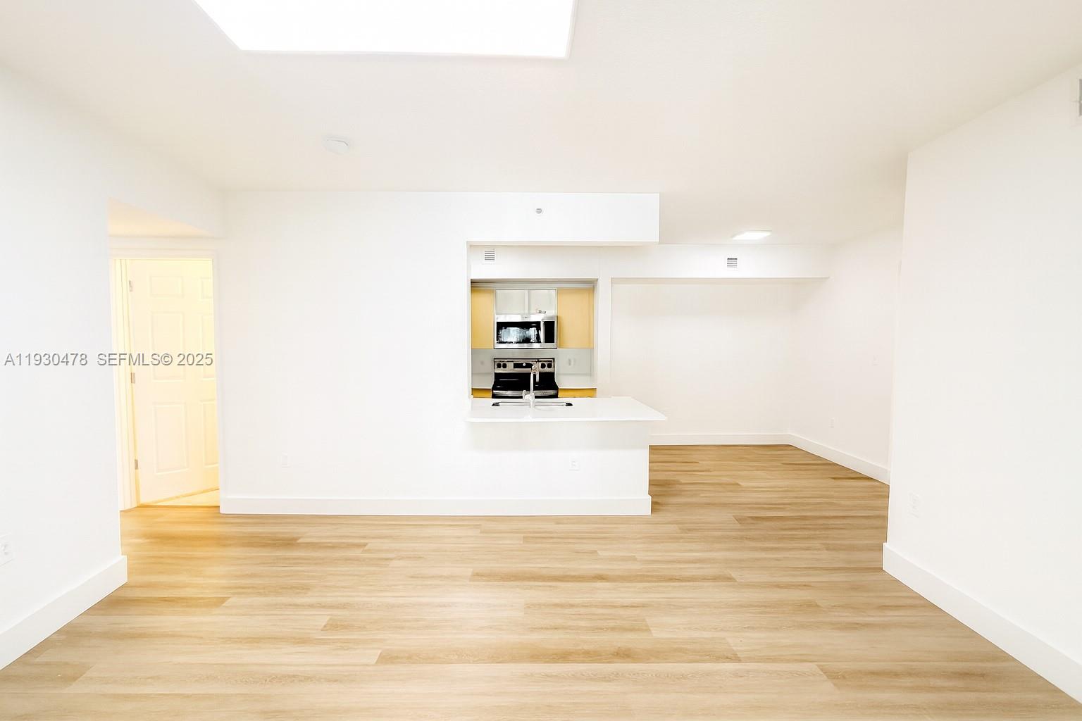 2564 Centergate Drive, Unit 208 Miramar, FL 33025 - Photo 14 of 31 a view of a living room with a sink