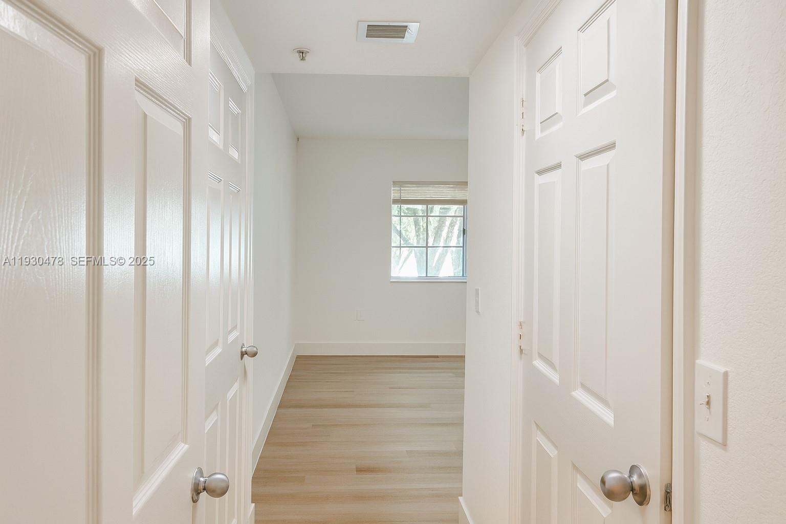 2564 Centergate Drive, Unit 208 Miramar, FL 33025 - Photo 2 of 31 a view of an entryway with wooden floor