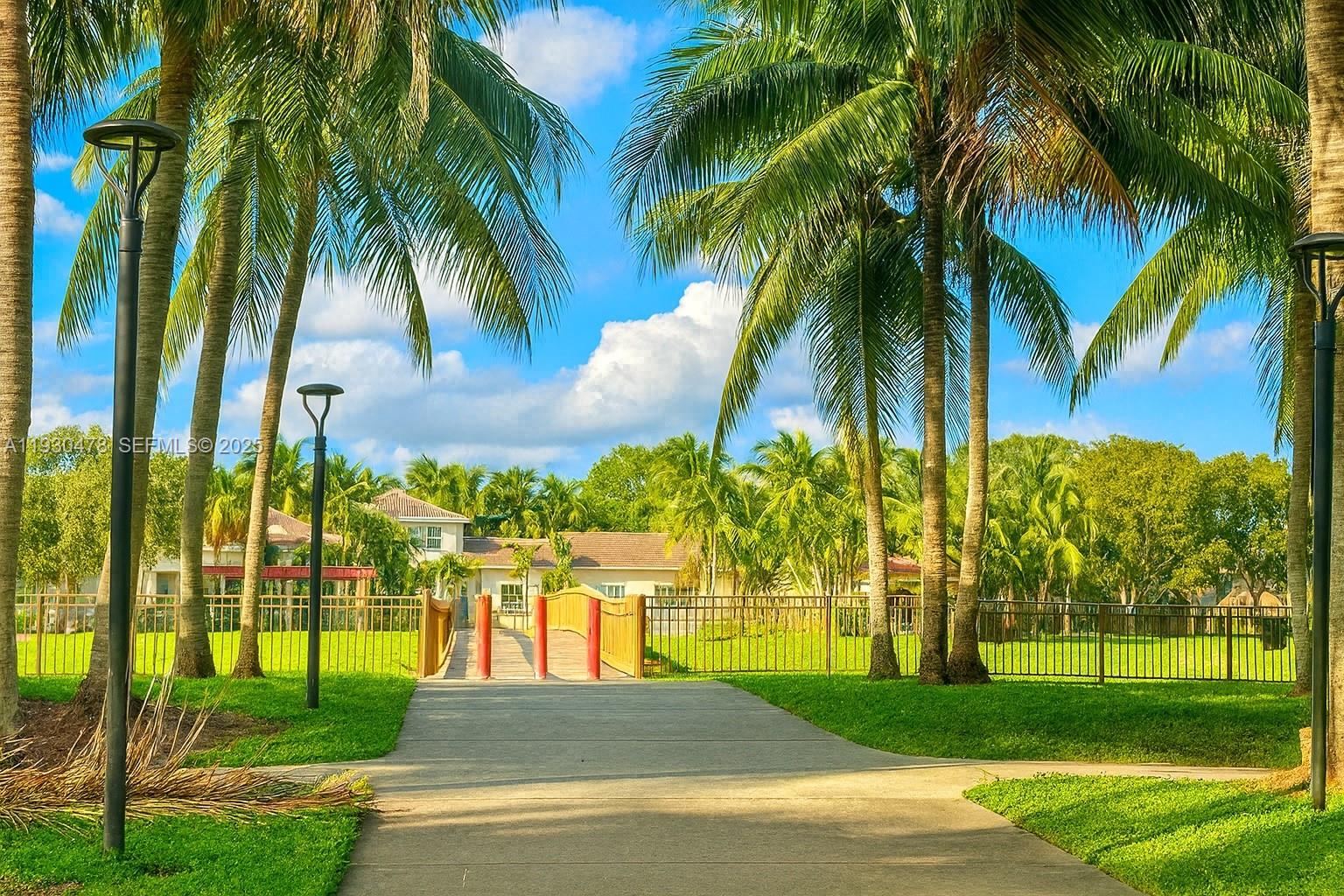 2564 Centergate Drive, Unit 208 Miramar, FL 33025 - Photo 24 of 31 a view of a park with a palm trees
