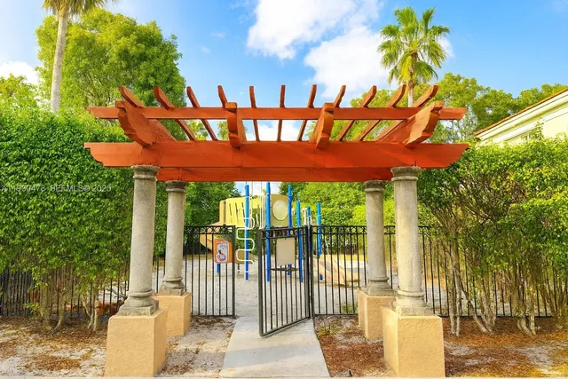 a view of a porch with furniture and floor to ceiling window