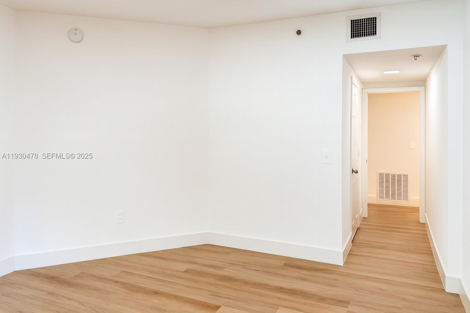 2564 Centergate Drive, Unit 208 Miramar, FL 33025 - Photo 6 of 31 a view of a room with wooden floor